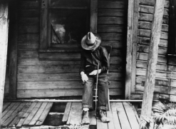 Old Man Sleeping on Porch